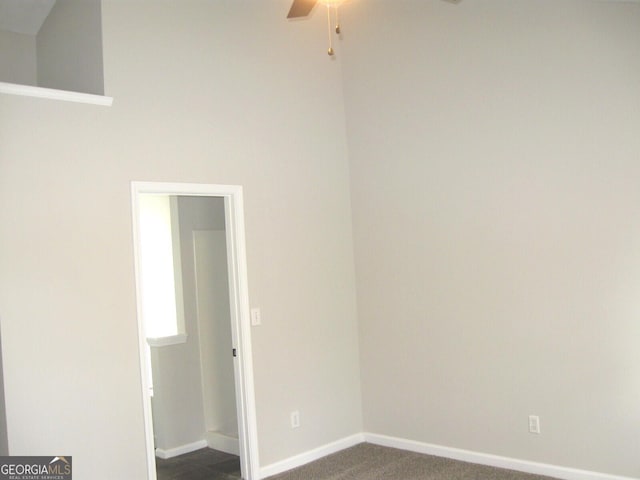 4383 Chestnut Lake Ave, Lithonia, GA 30038 - empty room with ceiling fan and dark colored carpet