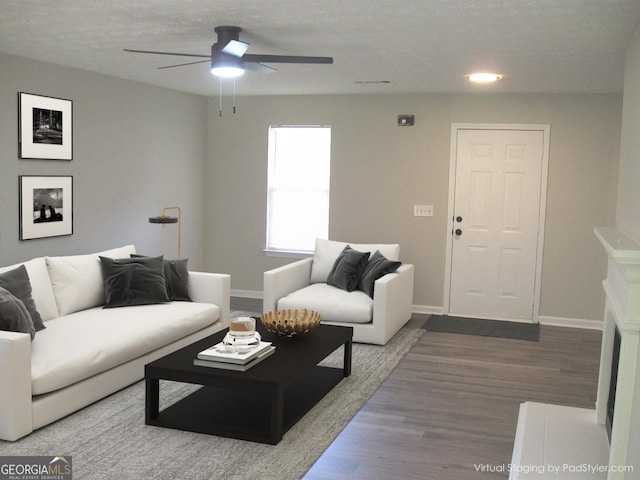 4383 Chestnut Lake Ave, Lithonia, GA 30038 - living area with ceiling fan, wood finished floors, and a textured ceiling