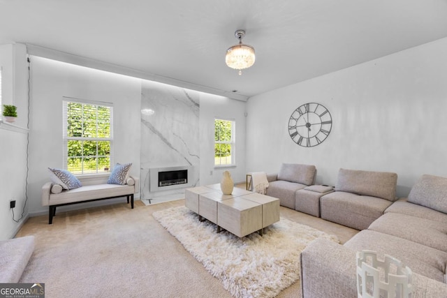 2584 Grayton Loop, Villa Rica, GA 30180 - living area featuring a premium fireplace and light carpet