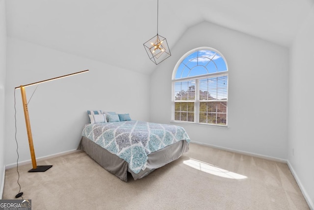 2584 Grayton Loop, Villa Rica, GA 30180 - carpeted bedroom with lofted ceiling, baseboards, and a chandelier