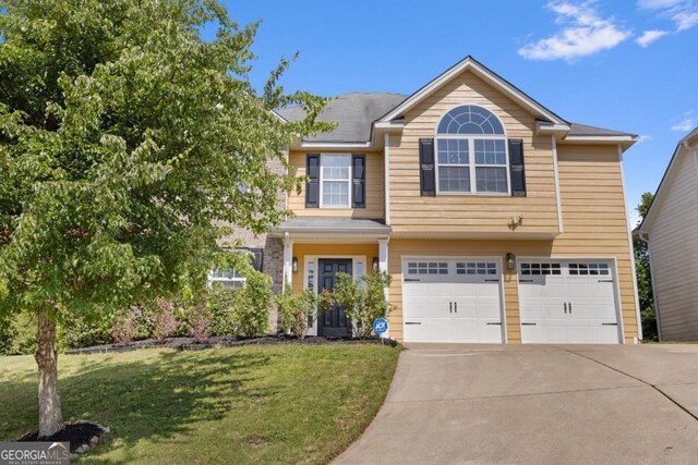 2584 Grayton Loop, Villa Rica, GA 30180 - view of front of property featuring an attached garage, concrete driveway, and a front lawn