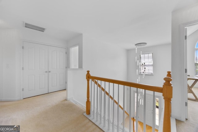 2584 Grayton Loop, Villa Rica, GA 30180 - hall with an upstairs landing, carpet floors, and baseboards