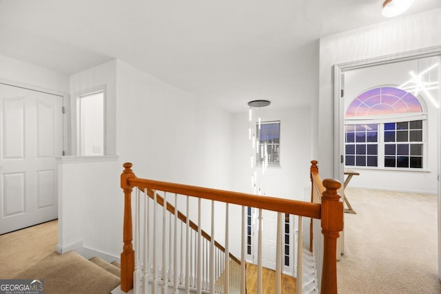 2584 Grayton Loop, Villa Rica, GA 30180 - hallway with an upstairs landing, carpet floors, and baseboards