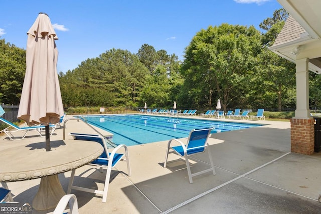 2584 Grayton Loop, Villa Rica, GA 30180 - community pool with a patio and view of wooded area