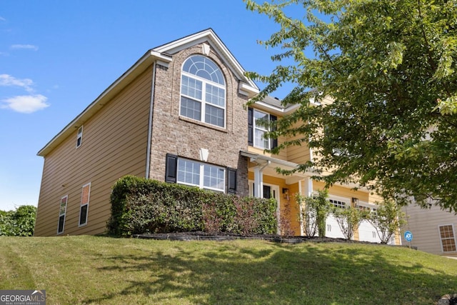 2584 Grayton Loop, Villa Rica, GA 30180 - view of front of property with a garage, a front yard, and stone siding