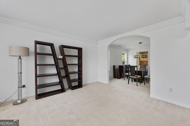2584 Grayton Loop, Villa Rica, GA 30180 - carpeted living area featuring arched walkways, crown molding, and baseboards