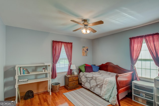 6 Greenleaf Dr SW, Rome, GA 30165 - bedroom with multiple windows, wood finished floors, and ceiling fan