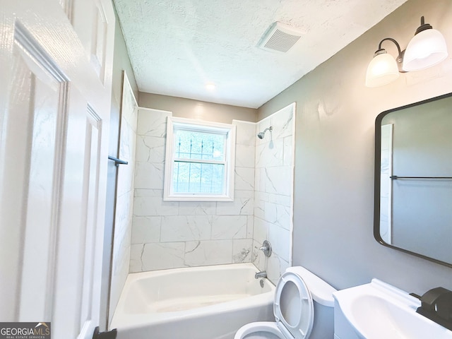 1502 12th St, Augusta, GA 30901 - full bathroom with toilet,  shower combination, vanity, and a textured ceiling