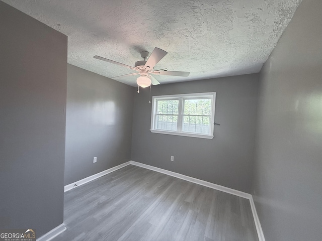 1502 12th St, Augusta, GA 30901 - empty room featuring ceiling fan, wood finished floors, baseboards, and a textured ceiling