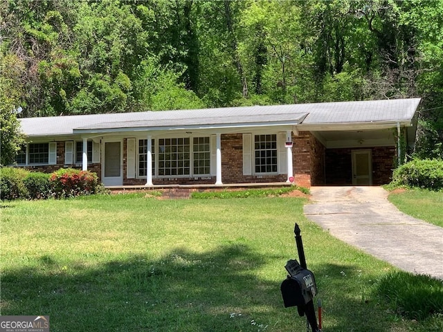 2703 Arrowood Dr, East Point, GA 30344 - ranch-style house featuring an attached carport, a front lawn, concrete driveway, and covered porch