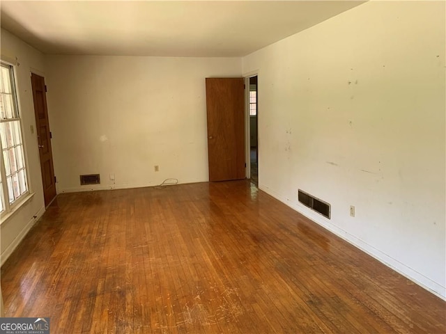 2703 Arrowood Dr, East Point, GA 30344 - unfurnished room featuring hardwood / wood-style flooring, healthy amount of natural light, and baseboards