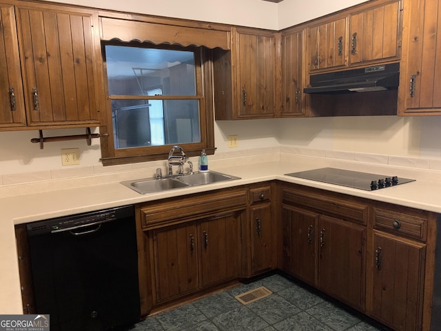 2242 Oakgrove Cir, Valdosta, GA 31602 - kitchen with black appliances, under cabinet range hood, a sink, and light countertops