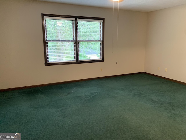 2242 Oakgrove Cir, Valdosta, GA 31602 - spare room featuring baseboards and dark carpet