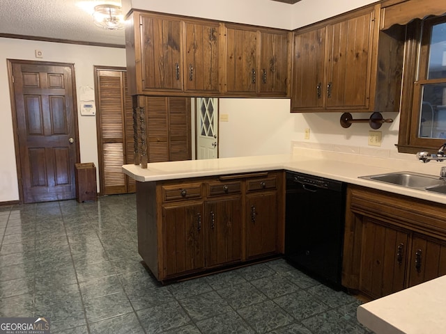 2242 Oakgrove Cir, Valdosta, GA 31602 - kitchen with black dishwasher, a sink, a peninsula, light countertops, and a textured ceiling