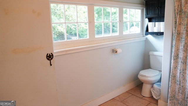 16156 Barnesville St, Zebulon, GA 30295 - bathroom featuring tile patterned flooring, toilet, and baseboards