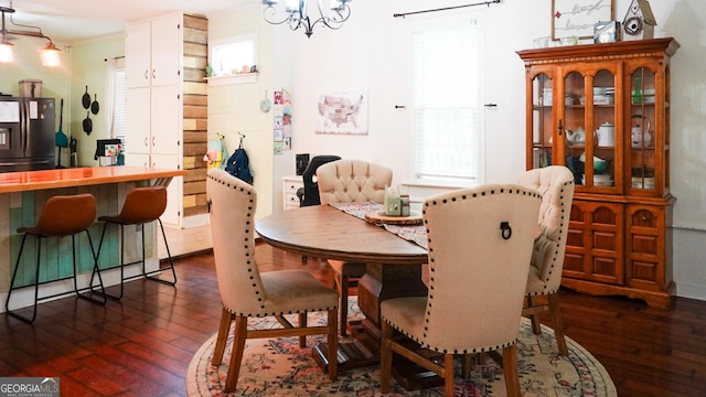 16156 Barnesville St, Zebulon, GA 30295 - dining area featuring dark wood finished floors and a chandelier