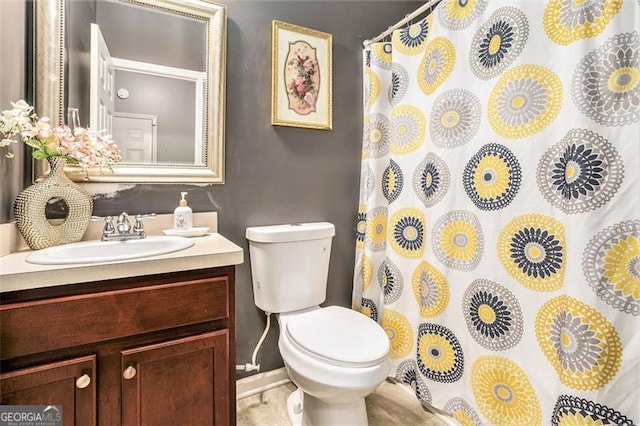 230 Haleys Ct, Woodstock, GA 30188 - full bathroom featuring vanity, toilet, curtained shower, and baseboards