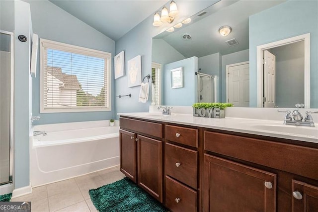 230 Haleys Ct, Woodstock, GA 30188 - bathroom featuring vaulted ceiling, a garden tub, tile patterned floors, a shower stall, and double vanity