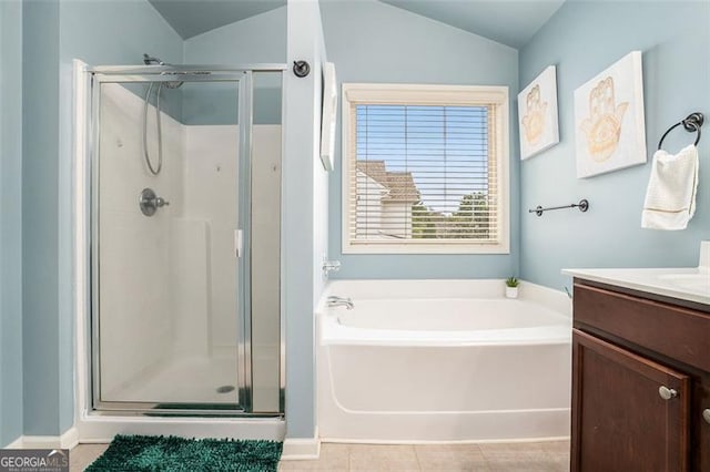 230 Haleys Ct, Woodstock, GA 30188 - full bathroom with a stall shower, a bath, vanity, lofted ceiling, and tile patterned flooring