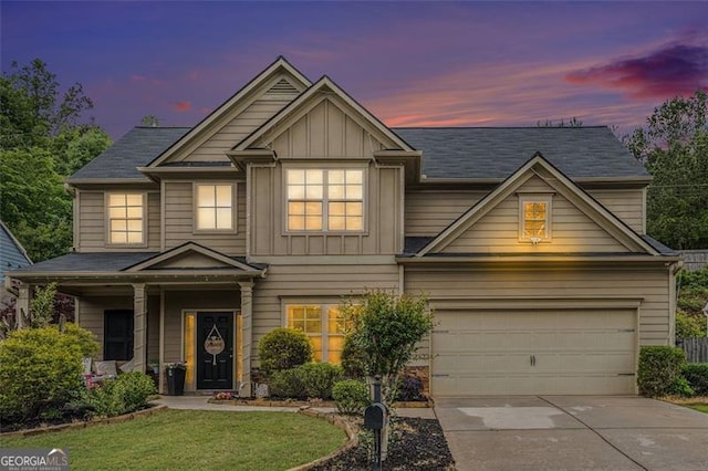 230 Haleys Ct, Woodstock, GA 30188 - craftsman-style house with concrete driveway, board and batten siding, a yard, a garage, and a porch