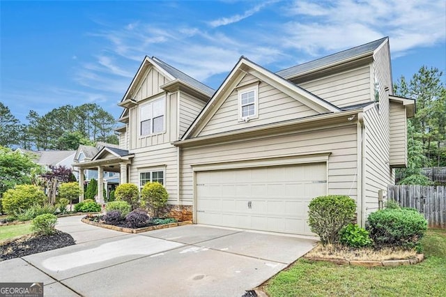 230 Haleys Ct, Woodstock, GA 30188 - view of front of property with driveway, board and batten siding, stone siding, and a garage
