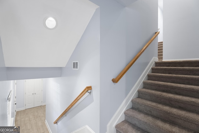 2067 Kinridge Ct, Marietta, GA 30062 - staircase with lofted ceiling, wood finished floors, and baseboards