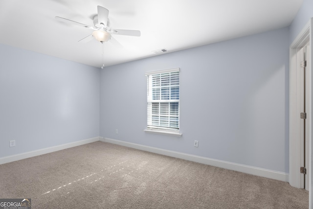2067 Kinridge Ct, Marietta, GA 30062 - spare room featuring carpet floors, ceiling fan, and baseboards