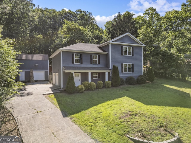 2067 Kinridge Ct, Marietta, GA 30062 - traditional-style home featuring concrete driveway, a front lawn, an outbuilding, and roof with shingles