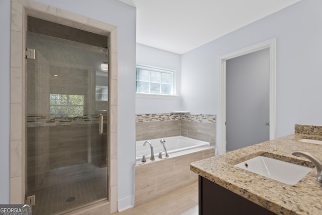 2067 Kinridge Ct, Marietta, GA 30062 - bathroom with double vanity, a garden tub, and a stall shower