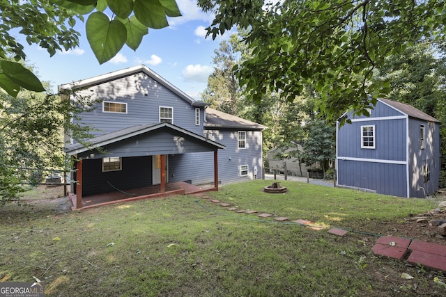 2067 Kinridge Ct, Marietta, GA 30062 - back of property with an outdoor fire pit and covered porch