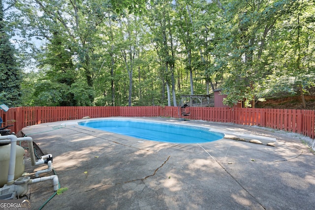 2067 Kinridge Ct, Marietta, GA 30062 - view of swimming pool featuring a diving board, a fenced backyard, and a patio