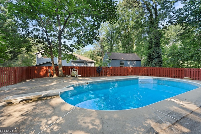 2067 Kinridge Ct, Marietta, GA 30062 - view of swimming pool featuring a diving board, a fenced backyard, and a patio