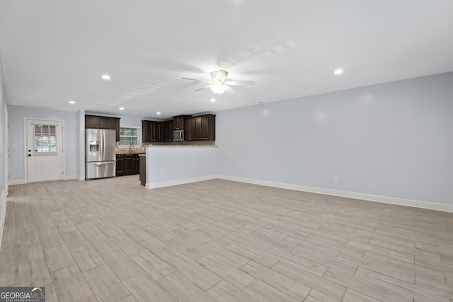 2067 Kinridge Ct, Marietta, GA 30062 - unfurnished living room featuring ceiling fan, recessed lighting, light wood finished floors, and baseboards
