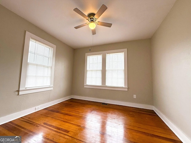 132 Carey St, Elberton, GA 30635 - spare room featuring hardwood / wood-style floors, baseboards, and a ceiling fan