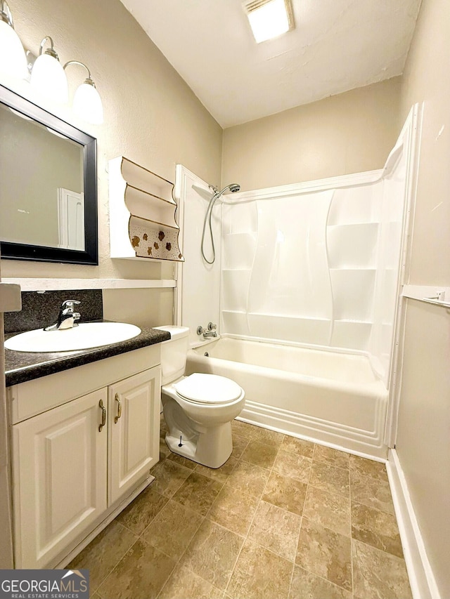 132 Carey St, Elberton, GA 30635 - full bath with vanity, bathtub / shower combination, toilet, and stone finish flooring