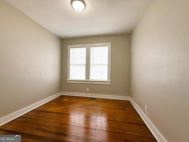 132 Carey St, Elberton, GA 30635 - spare room featuring hardwood / wood-style flooring and baseboards