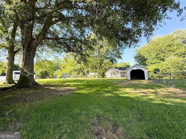 132 Carey St, Elberton, GA 30635 - view of yard featuring a detached carport and an outbuilding