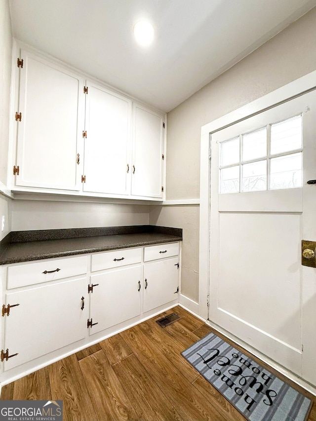 132 Carey St, Elberton, GA 30635 - laundry room with dark wood-style floors