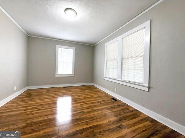 132 Carey St, Elberton, GA 30635 - unfurnished room with crown molding, wood finished floors, and baseboards