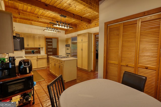 2905 Cammie Wages Rd, Dacula, GA 30019 - kitchen with wooden ceiling with exposed beams, dark tile patterned floors, light countertops, decorative backsplash, and a center island
