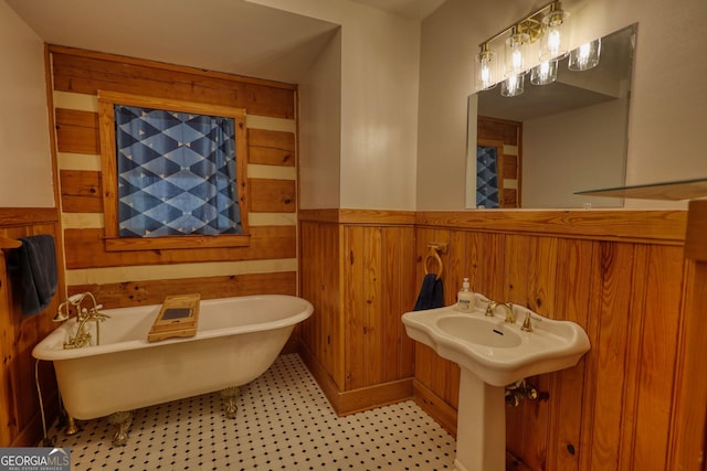 2905 Cammie Wages Rd, Dacula, GA 30019 - bathroom with wood walls, wainscoting, and a freestanding bath
