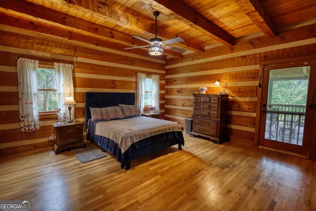 2905 Cammie Wages Rd, Dacula, GA 30019 - bedroom featuring wooden ceiling with exposed beams, wooden walls, and light wood-type flooring