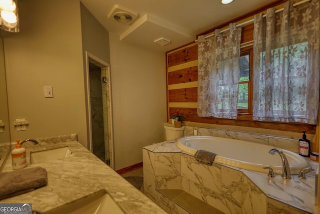2905 Cammie Wages Rd, Dacula, GA 30019 - bathroom featuring a garden tub, vanity, and baseboards