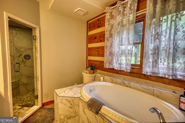 2905 Cammie Wages Rd, Dacula, GA 30019 - bathroom featuring a shower stall, a garden tub, and baseboards