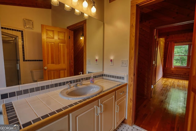 2905 Cammie Wages Rd, Dacula, GA 30019 - bathroom featuring vanity, toilet, a shower stall, and wood finished floors