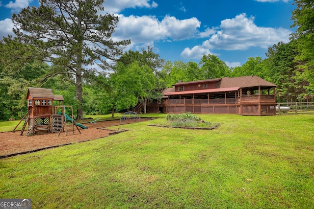 2905 Cammie Wages Rd, Dacula, GA 30019 - view of green lawn with a playground and view of scattered trees