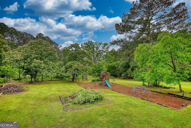 2905 Cammie Wages Rd, Dacula, GA 30019 - view of green lawn with a playground