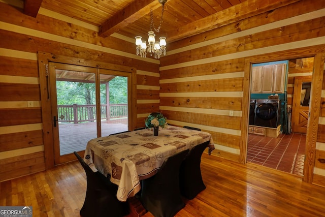 2905 Cammie Wages Rd, Dacula, GA 30019 - dining room with washer and dryer, wooden ceiling with exposed beams, a chandelier, wood walls, and wood finished floors