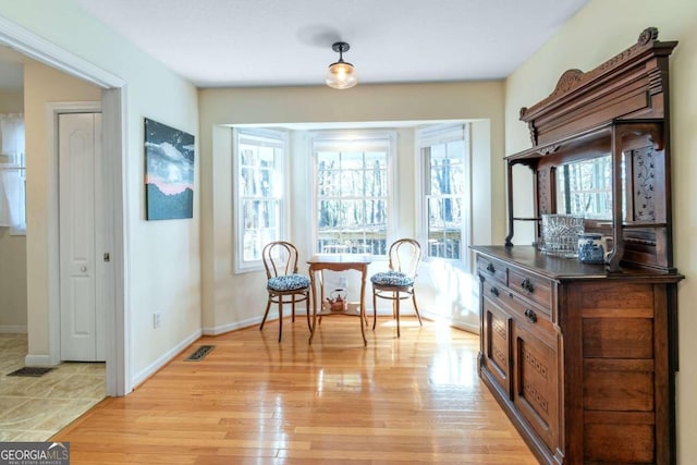 32 N Muscogee Dr, Ellijay, GA 30540 - living area featuring light wood-style flooring and baseboards