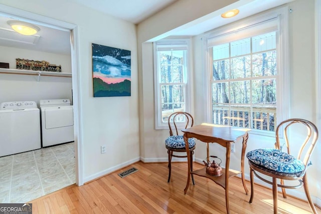 32 N Muscogee Dr, Ellijay, GA 30540 - sitting room featuring independent washer and dryer, healthy amount of natural light, and light wood-style floors